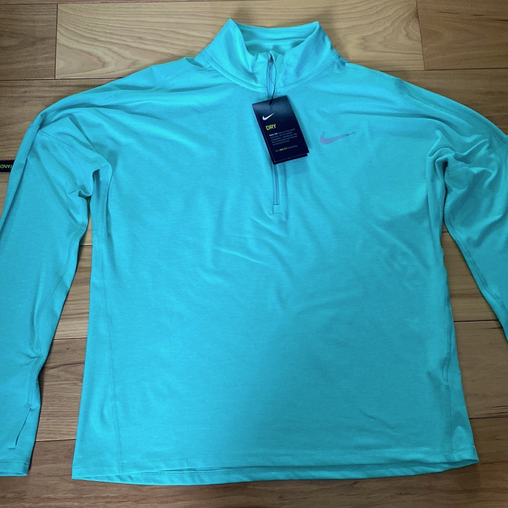 Brand new mint color Nike Dry-Fit long sleeved running shirt. Size women’s M.